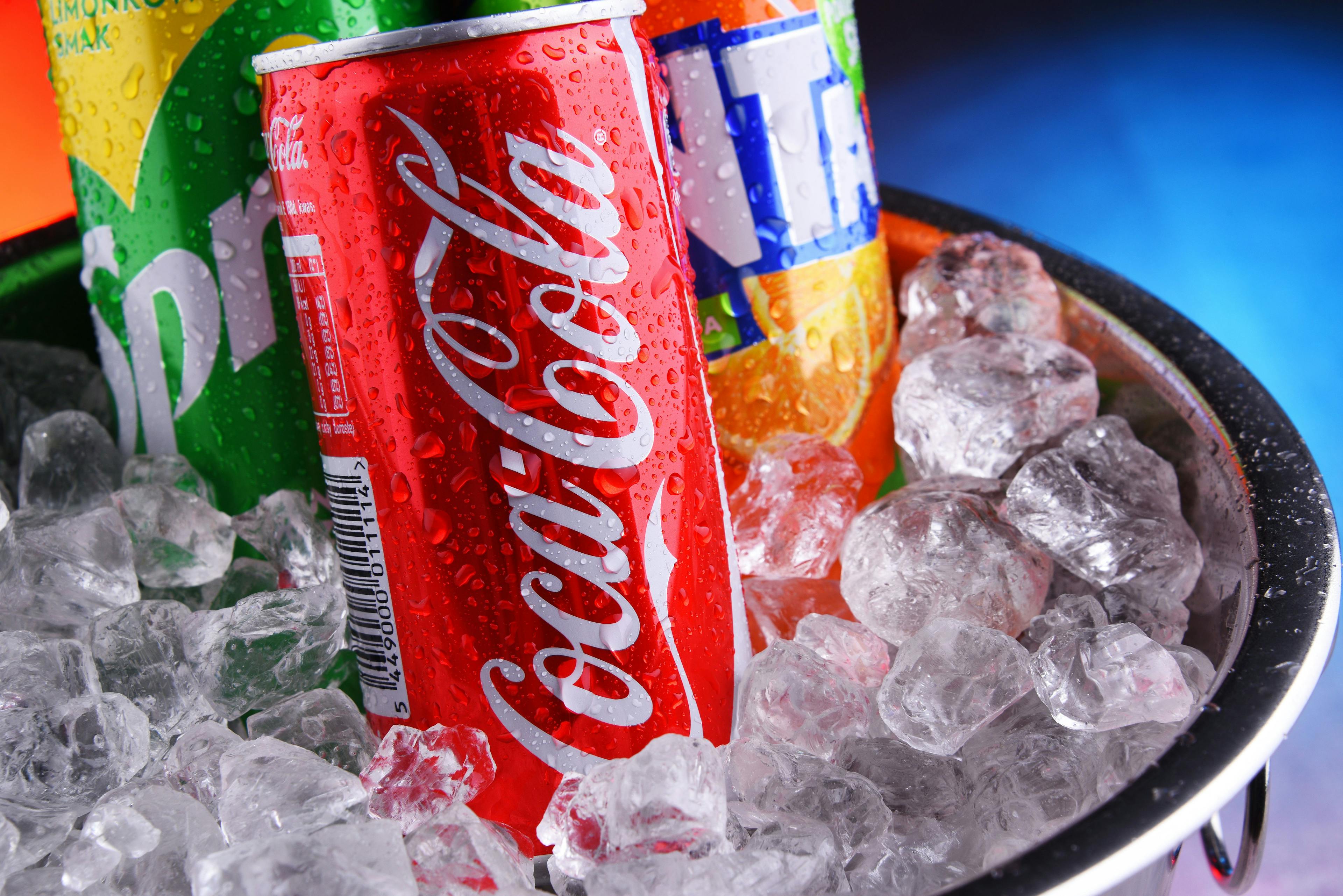 Cans of assorted Coca Cola Company soft drinks | Image Credit: © monticellllo - stock.adobe.com.