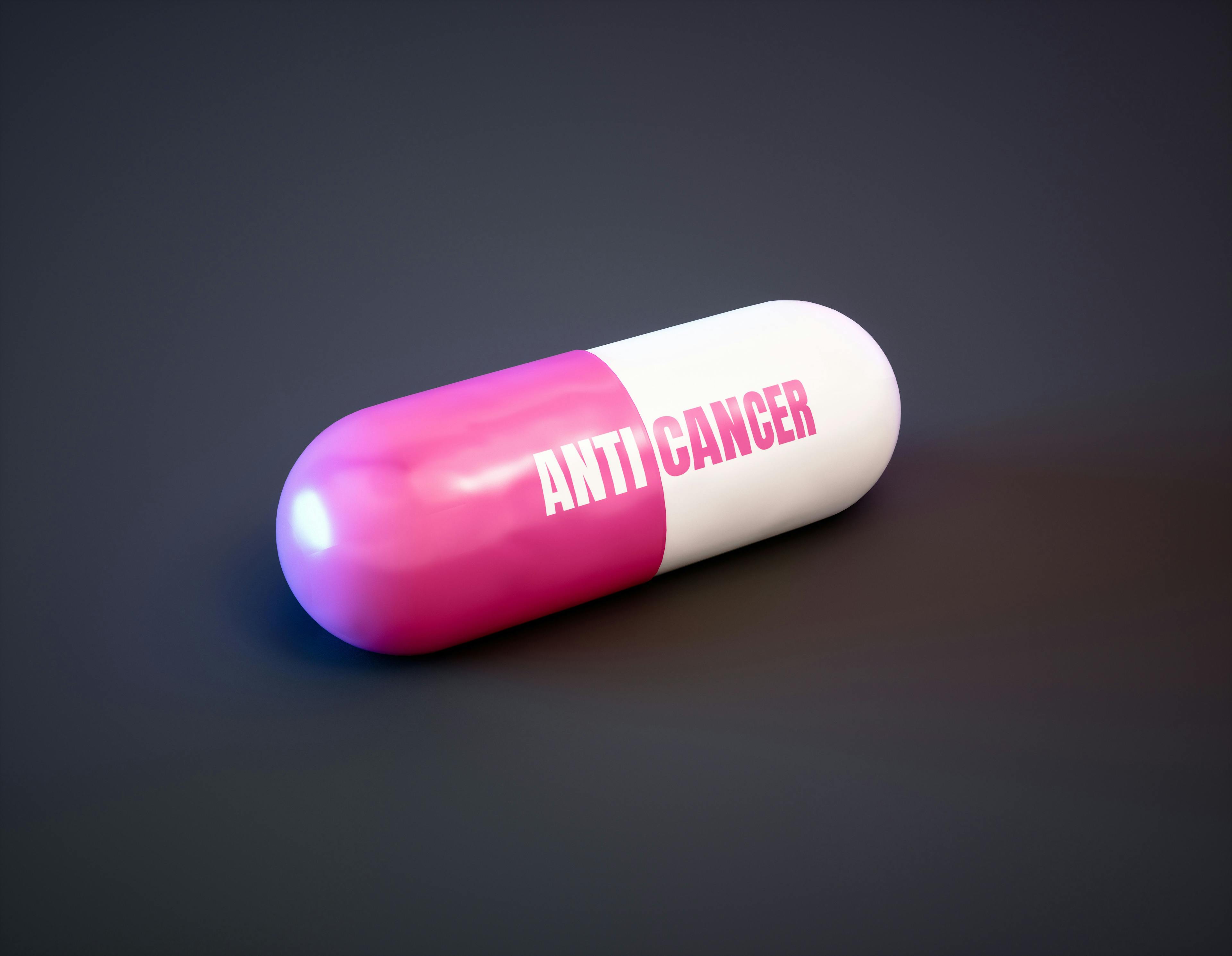 Cancer therapy drugs concept. Pink pill with text on black background. 3d illustration. | Image Credit: © malp - stock.adobe.com