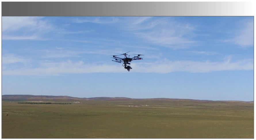 FIGURE 1: Image of UAV hyperspectral remote sensing system in flight.