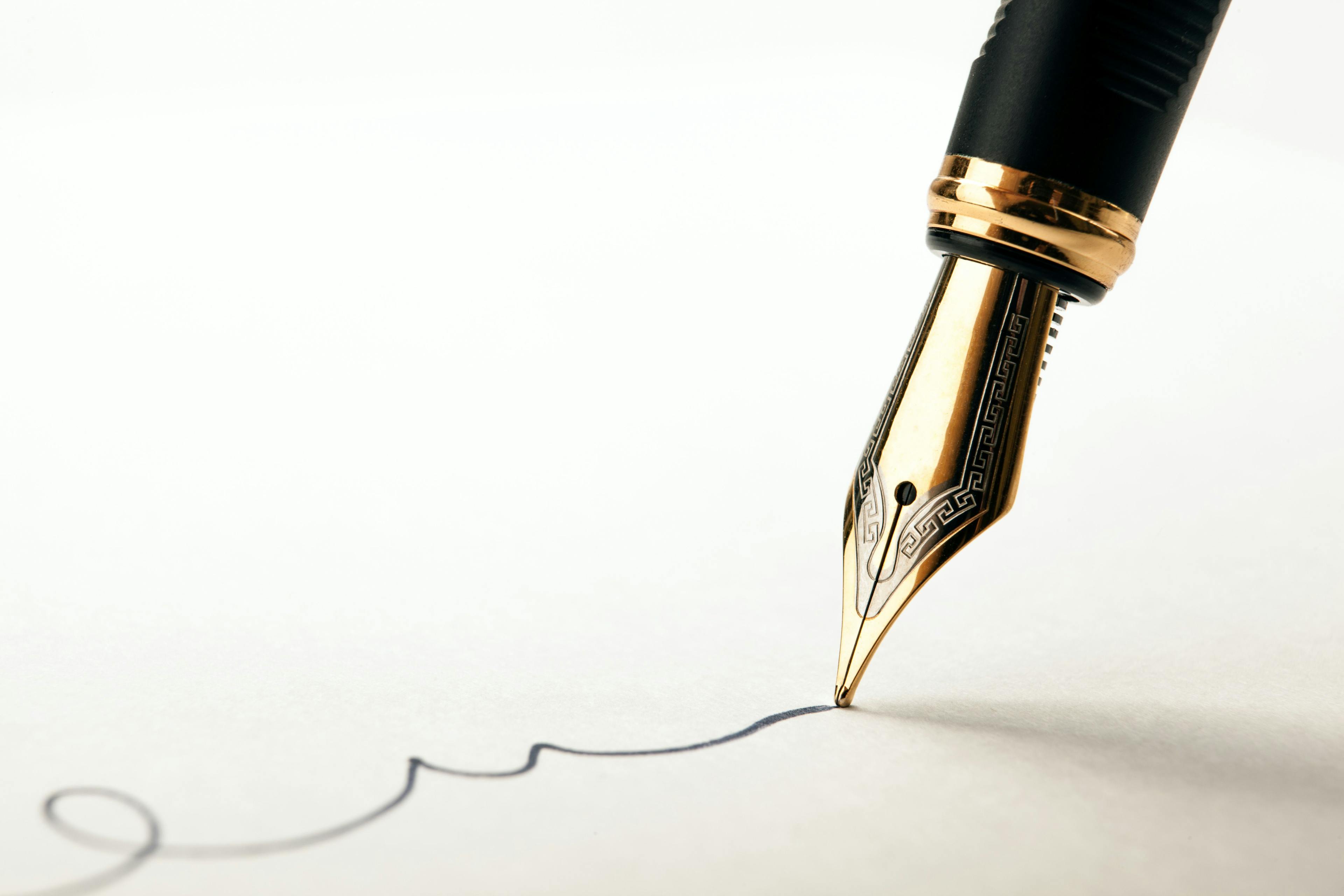 golden fountain pen leaves a signature on a white paper | Image Credit: © mizar_21984 - stock.adobe.com.