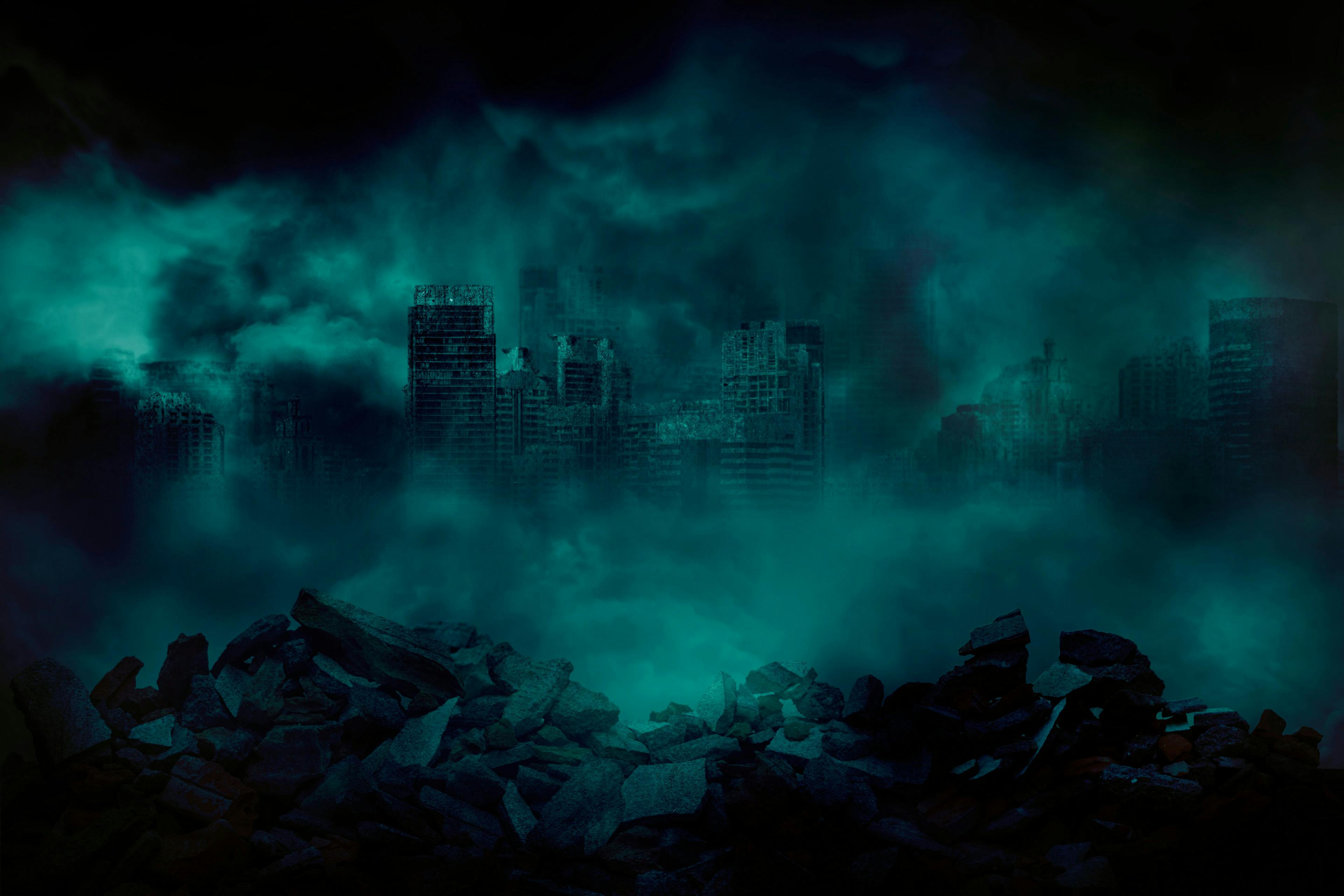 The ruins of a large city building with pieces of concrete and brick rubble debris in front are covered with smoke from the civil war and the city abandonment, concept of war | Image Credit: © holwichaikawee - stock.adobe.com