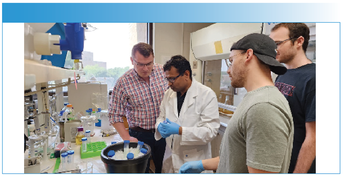 Professor Kurouski (first on the left) discusses with Dr. Abid Ali (center) and two undergraduate students (Luke Osborne and Joseph Wilson), the strategies for the expression of alpha-synuclein, a protein that is linked to Parkinson disease.