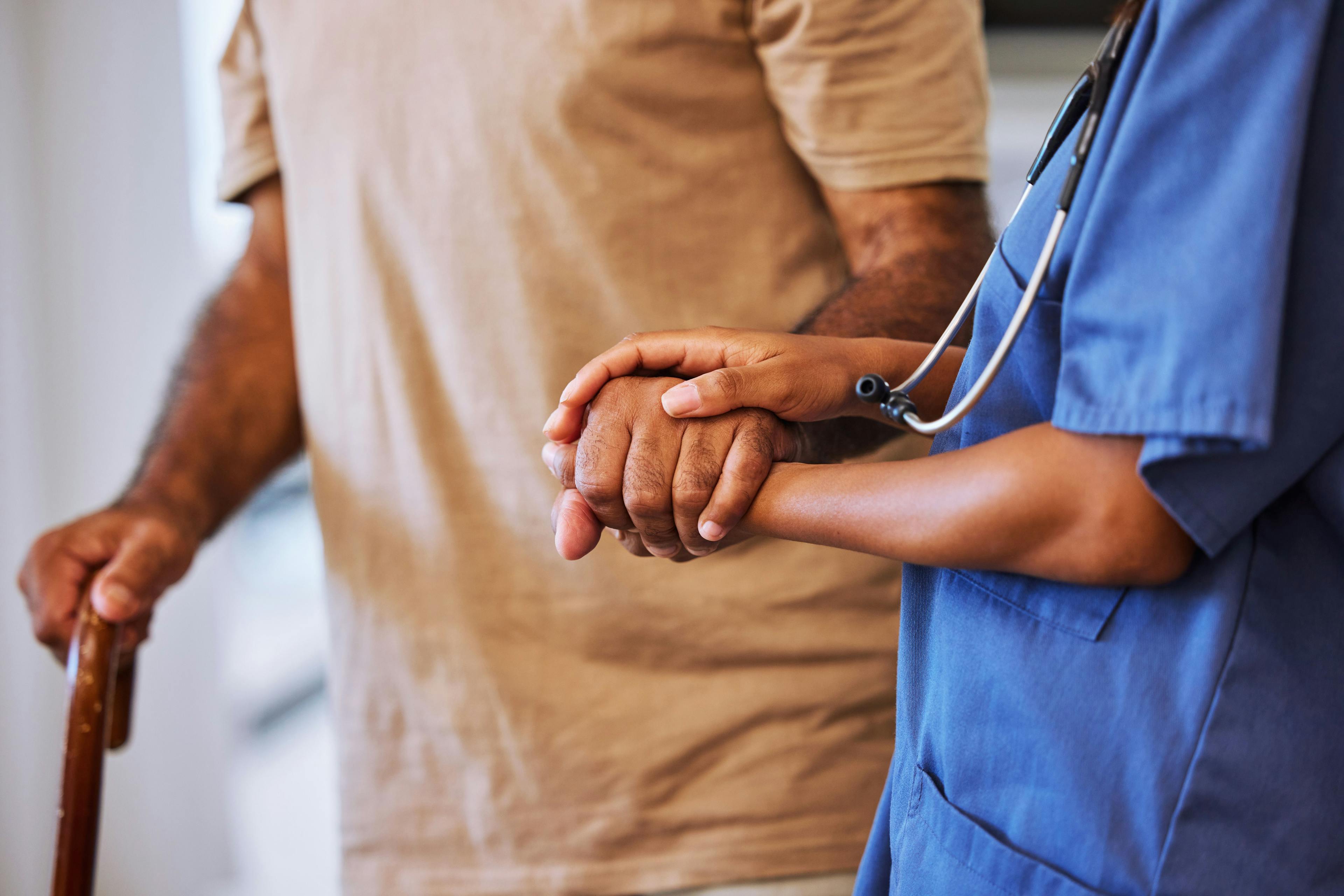 Support, trust and help from caregiver or nurse walking with senior man or patient in retirement home with healthcare insurance. Hands of female medical worker and alzheimers male with hospice care | Image Credit: © Beaunitta Van Wyk/peopleimages.com - stock.adobe.com