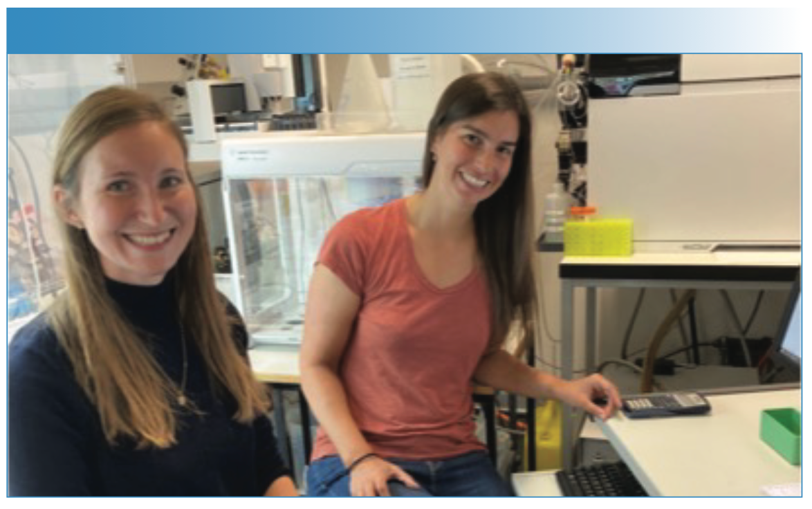 Alissa Tophinke and Denise Mitrano in the laboratory working at an ICP-MS instrument.