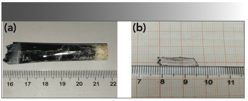 FIGURE 2: Photographs of (a) NaY(MoO4)2:Yb3+/Tm3+ crystal, and (b) annealed NaY(MoO4)2:Yb3+/Tm3+ crystal sample with the size of 15 × 5 × 1 mm3.